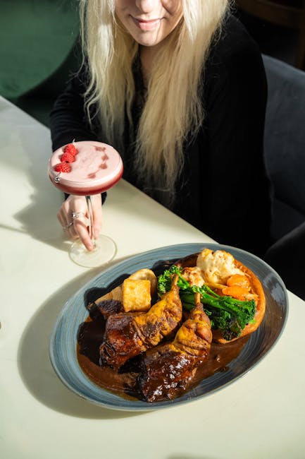 Delicious gourmet roast dinner with a berry cocktail, perfect for special occasions.